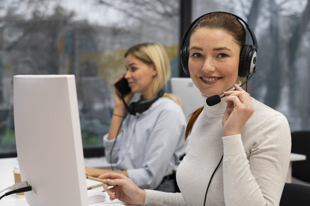 woman-working-call-center-talking-with-clients-using-headphones-microphone
