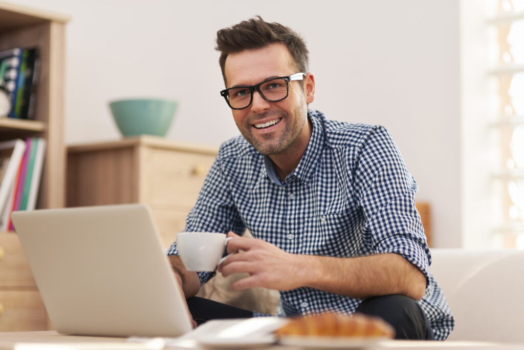 Portrait of smiling man working at home